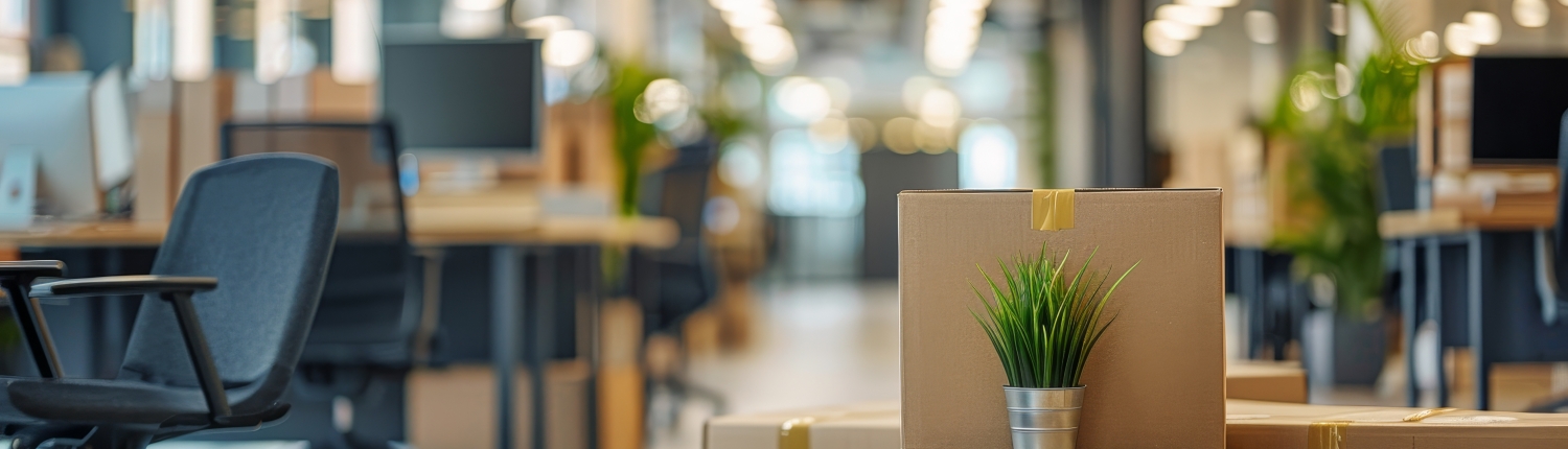 Boxes packed and ready for relocation in a modern office space, highlighting I Love Moving’s commercial moving expertise.