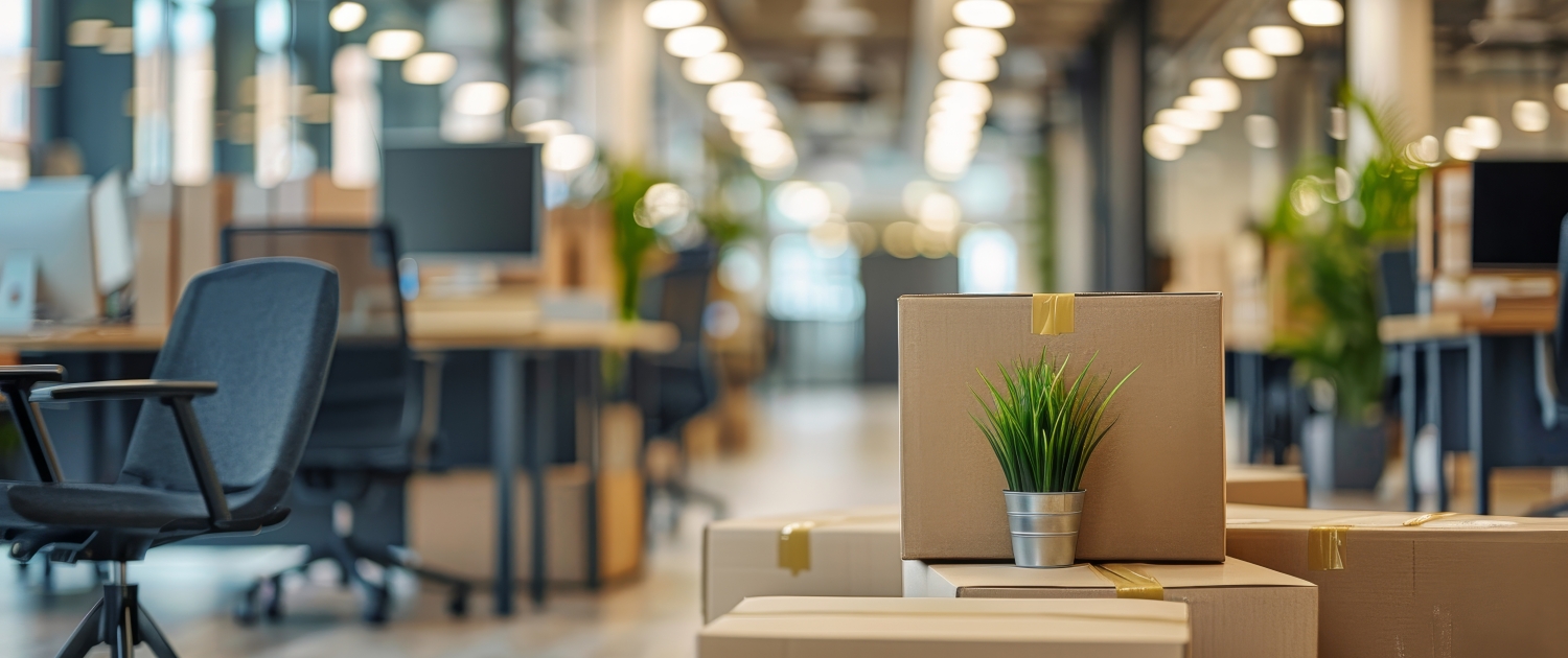 Expert Commercial Moving Solutions Boxes packed and ready for relocation in a modern office space, highlighting I Love Moving’s commercial moving expertise.